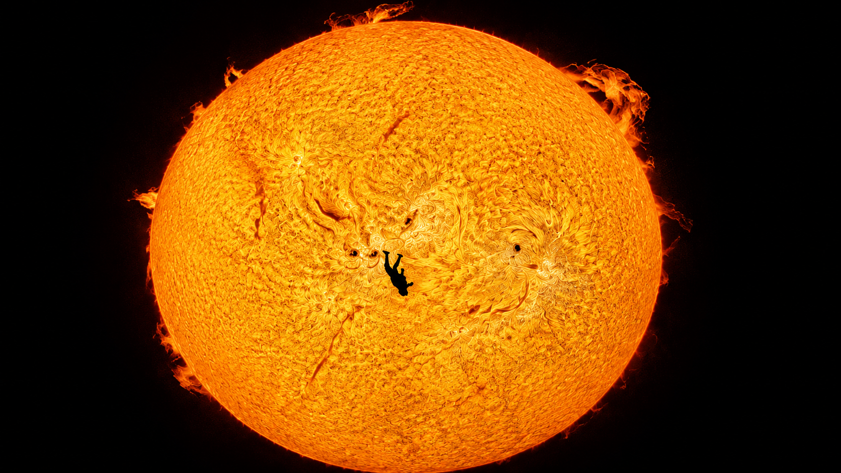 Skydiver crossing the face of the Sun in The Fall of Icarus photograph